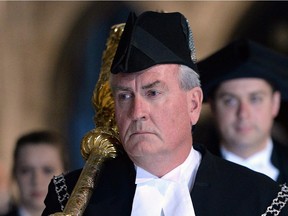 House of Commons Sergeant-at-Arms Kevin Vickers carries the mace during the Speakers Parade on Parliament Hill in Ottawa on Thursday, Oct. 23, 2014.