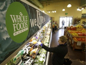 In this March 27, 2014 photo, a woman shops at the Whole Foods Market in Woodmere Village, Ohio.
