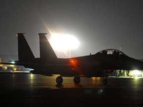 In this Sept. 23, 2014 photo provided by the U.S Air Force, an F-22A Raptor taxis in the U.S. Central Command area of responsibility prior to strike operations in Syria.  (AP Photo/U.S. Air Force, Russ Scalf)