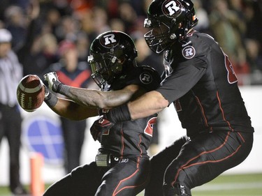Ottawa Redblacks Jeremiah Johnson (27) Colin Kelly (67) celebrate a touchdown against the Hamilton Tiger-Cats during first half CFL action.