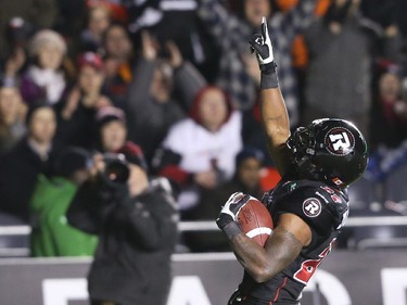 Jeremiah Johnson of the Ottawa Redblacks celebrates his touchdown against the Hamilton Tiger-Cats during first half CFL action.