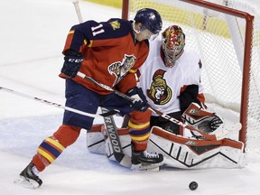 The Florida Panthers'  Jonathan Huberdeau is denied by  Craig Anderson during the second period on Monday in Sunrise, Fla.