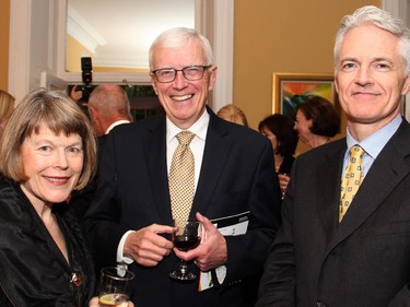Judy Mills and Russell Mills, board chair of the National Capital Commission, with Christopher Deacon, managing director the National Arts Centre Orchestra (NACO), at a reception held Wednesday, Oct. 8, 2014, to celebrate the NACO's tour to the UK.