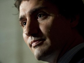 Liberal Leader Justin Trudeau speaks with the media following party caucus Wednesday October 8, 2014 in Ottawa.