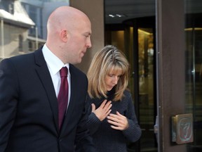 Katherine (Kathy) Kitts exits the Elgin St. courthouse with her lawyer Mike Purcell after being released on bail in Ottawa on Tuesday, October 7, 2014. Kitts is a teacher's assistant charged with sex assault on a 15-year-old male. Mike Carroccetto / Ottawa Citizen