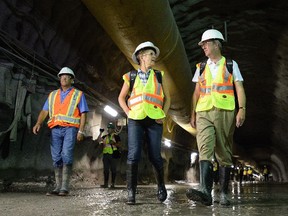 Ontario Premier Kathleen Wynne and Ottawa Mayor Jim Watson tour the Confederation Line light rail transit tunnel in downtown Ottawa on Monday, Aug. 11, 2014. This section of tunnel so far runs from Lebreton Flats to Lion Street.