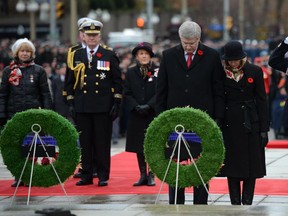 Prime Minister Stephen Harper lays a wreath at the National War Memorial for Remembrance Day in November 2013.