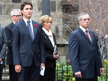 Liberal Leader Justin Trudeau, centre, and Treasury Board President Tony Clement, right, attend the regimental funeral service for Cpl. Nathan Cirillo.