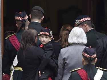 Marcus Cirillo, son of Cpl. Nathan Cirillo, looks back as family members enter Christ's Church Cathedral for the funeral of his father.