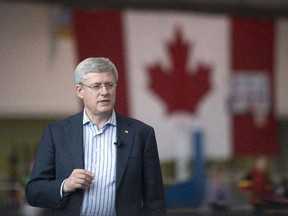 Prime Minister Stephen Harper speaks at the Abilities Centre in Whitby, Ont. on Thursday, where he said police agencies would get more powers to track potential terror suspects.