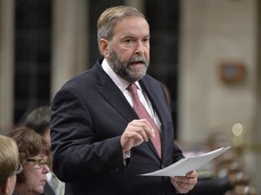 NDP Leader Tom Mulcair rises to debate the government's decision to join a broad coalition of allies in airstrikes against ISIL, in the House of Commons in Ottawa on Monday, Oct. 6, 2014.