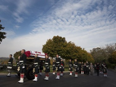 The coffin of Cpl. Nathan Cirillo is escorted through the streets toward his funeral service.