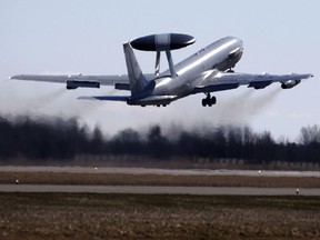 NATO Airborne Warning and Control System (AWACS) aircraft  take off  during the Lithuanian - NATO  air force exercise at the Siauliai airbase some 230 km. (144 miles) east of the capital Vilnius,  Lithuania, Tuesday, April 1, 2014.  The air training event will involve F-15C Eagle of the U.S. Air Force currently deployed on NATOs Baltic Air Policing mission, JAS-39 Gripen aircraft of the Swedish Air Force, C-27J Spartan transport aircraft and Mi-8 helicopter of the Lithuanian Air Force. Furthermore, NATO Airborne Warning and Control System (AWACS) aircraft based in Germany and U.S. KC-135R air refuelling aircraft are expected to join the exercise. The Baltic Regional Training Event demonstrate NATO commitments to collective defence, Alliance solidarity and confidence. (AP Photo/Mindaugas Kulbis)