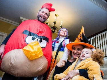 NDP leader Tom Mulcair and his wife Catherine pose with their grandchildren, Juliette and Raphael at their Ottawa home on Halloween.