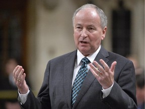 Defence Minister Rob Nicholson responds to a question during Question Period in the House of Commons, Thursday, Oct. 2, 2014 in Ottawa. Nicholson is refusing to say whether Canada will bow out of its planned combat role in Iraq after six months or seek an extension.