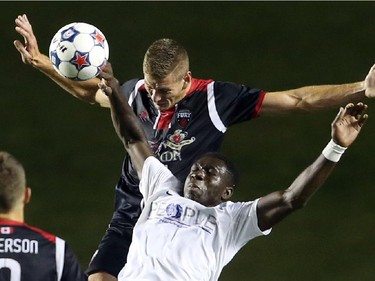 Omar Jarun, top, of the Fury FC battles against Kwado Poku of the Atlanta Silverhawks during first half action.