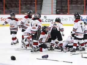 Members of the Stittsville Spartans celebrate their double overtime win against the Beijing Snow Leopards during Bell Capital Cup Atom House A hockey action at Canadian Tire Centre, in Ottawa, ON, on January 01, 2014.