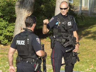 Ottawa police respond to reports that five or six gunshots had been fired in the Pinecrest Terrace housing development on Friday, October 3, 2014.