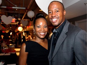 Ottawa Redblacks quarterback Henry Burris with his wife, Nicole, at the inaugural HERA Mission charity gala in support of widows and orphans in western Kenya, co-hosted by the Ottawa Redblacks CFL team at the TD Place on Wednesday, Oct. 15, 2014.