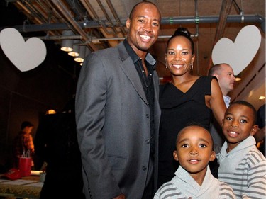 Ottawa Redblacks quarterback Henry Burris with his wife, Nicole, and their sons, Barron, five, and Armand, eight, at the inaugural HERA Mission charity gala in support of widows and orphans in western Kenya, co-hosted by the Redblacks at the TD Place on Wednesday, Oct. 15, 2014.