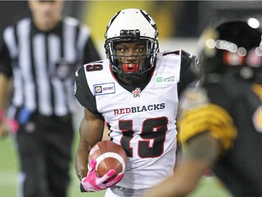 Roy Finch #19 of the Ottawa Redblacks runs the ball against the Hamilton Tiger-cats.