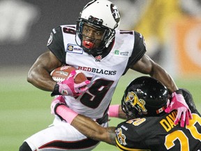 Roy Finch #19 of the Ottawa Redblacks runs the ball against the Hamilton Tiger-cats.