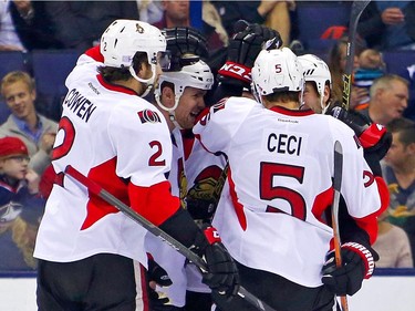 Zack Smith #15 of the Ottawa Senators is congratulated by his teammates after scoring a goal during the second period.