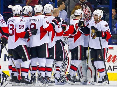 Robin Lehner #40 of the Ottawa Senators is congratulated by his teammates after defeating the Columbus Blue Jackets 5-2.