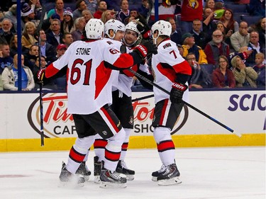 Alex Chiasson #90 of the Ottawa Senators is congratulated by his teammates after scoring a goal during the third period.