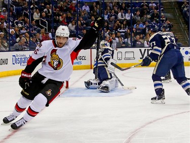 Clarke MacArthur #16 of the Ottawa Senators celebrates after beating Curtis McElhinney #30 of the Columbus Blue Jackets for a goal during the third period.