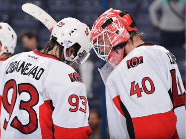 Mika Zibanejad #93 of the Ottawa Senators congratulates goaltender Robin Lehner #40 of the Ottawa Senators after defeating the Columbus Blue Jackets 5-2.