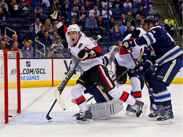 Kyle Turris #7 of the Ottawa Senators celebrates after Clarke MacArthur #16 of the Ottawa Senators redirected a shot past Curtis McElhinney #31 of the Columbus Blue Jackets for a goal during the first period.