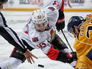 Mika Zibanejad #93 of the Ottawa Senators faces off against Paul Gaustad #28 of the Nashville Predators.