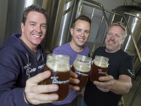 Owners Dave Howard, left, Ian McMartin and Mike Feagan are photographed at Whiprsnapr Brewing Co. in Ottawa on Monday, Oct. 27, 2014.