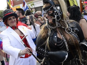 Participants in the Capital Pride Parade march on Bank Street on Sunday, Aug. 24, 2014.