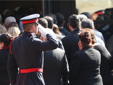 People arrive at the funeral for Staff Sgt. Kal Ghadban.