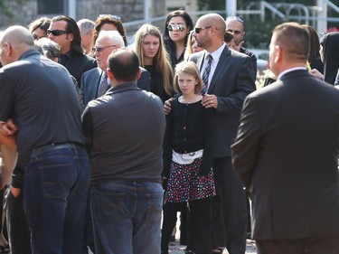 People arrive at the funeral for Staff Sgt. Kal Ghadban.