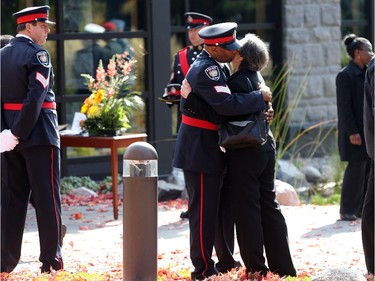 People arrive at the funeral for Staff Sgt. Kal Ghadban.