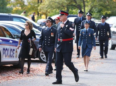 People arrive at the funeral for Staff Sgt. Kal Ghadban.