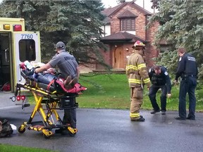 A victim is taken to hospital following a collision between a schoolbus and car in Aylmer Wednesday.