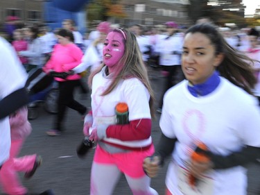 Pink face paint adorns a runner at the start of the CIBC Run for the Cure in Ottawa on Sunday, October 5, 2014.