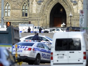 Police converge on Parliament Hill in Ottawa on Wednesday Oct.22, 2014. A Canadian soldier standing guard at the National War Memorial in Ottawa has been shot by an unknown gunman and there are reports of gunfire inside the halls of Parliament.