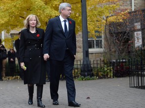 Prime Minister Stephen Harper and his wife Laureen arrive for Cpl. Nathan Cirillo's funeral service in Hamilton, Ont., on Tuesday, October 28, 2014. Cirillo was standing guard at the National War Memorial in Ottawa last Wednesday when he was killed by a gunman who went on to open fire on Parliament Hill.