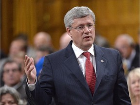 Prime Minister Stephen Harper responds to a question during Question Period in the House of Commons, Tuesday, September 30, 2014 in Ottawa.