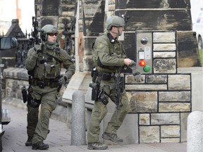 RCMP officers secure an entrance to Parliament Hill during the Oct. 22 lockdown after a gunman's attack.