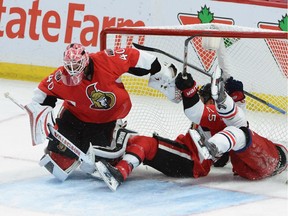 Ottawa Senators goaltender Robin Lehner provided solid goaltending against Columbus. Here tries to avoid being hit by teammate Chris Neil as he crashes the net with Columbus Blue Jackets' Jack Skille during third period Saturday night.