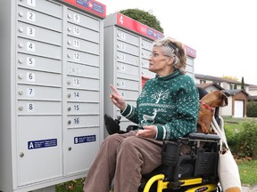 Ruth Hurst points to her initial mailbox on Monday.