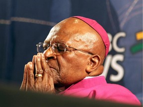 South Africa's Archbishop Desmond Tutu pauses for a moment during a media briefing on December 6, 2013 in Cape Town, a day after the death of his friend and former South African President Nelson Mandela.