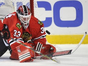Chicago Blackhawks goalie Scott Darling makes a save during the first period of an NHL hockey game against the Ottawa Senators in Chicago, Sunday, Oct. 26, 2014.