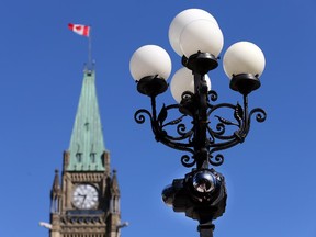 Security measures on Parliament Hill such as road blocks and discreet security cameras  seen here. Photo taken at 09:28 on June 20, 2014.